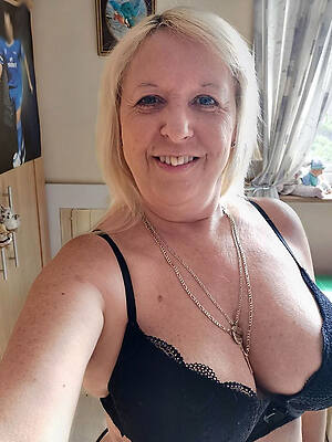 American mature women in bra shows off wholeness